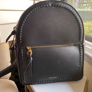 Calpak mini backpack made from an elegant faux leather.